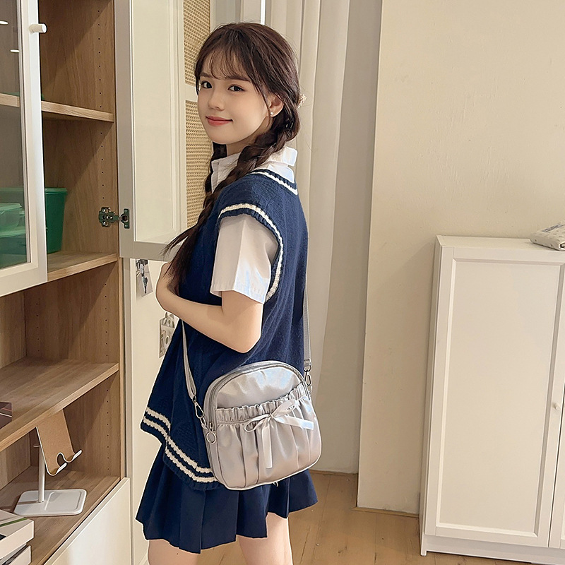 Detachable single-shoulder crossbody bag, college-style bow bow backpack, large-capacity commuting forest-style schoolbag, pain bag and kid bag details Picture