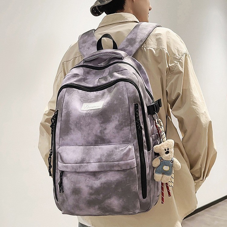 The new forest-style in high-appeal tie-dye color-blocking backpack is a casual, lightweight and large-capacity backpack for junior and senior high school students details Picture