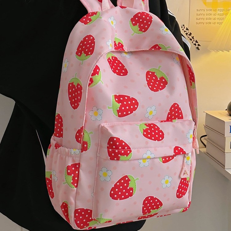 The 2025 new high-appeartion-level strawberry print backpack is a fashionable travel backpack for girls and a schoolbag for junior and senior high school students full figure