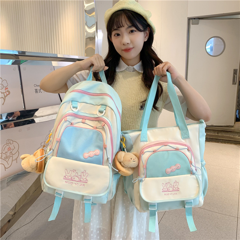 A cute two-piece backpack set of forest style for middle school students from grades three to six with a Japanese and Korean ins school style color contrast full figure