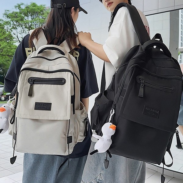 A new high-appeal, fresh solid color, niche and individual backpack from Korean Instagram, a simple and lightweight travel backpack for couples full figure