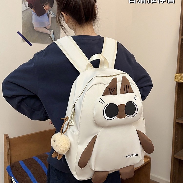 The 2025 new style of ugly and cute large-capacity backpack is unique and adorable. It's a cartoon and funny backpack for students in grades 1 to 6 details Picture