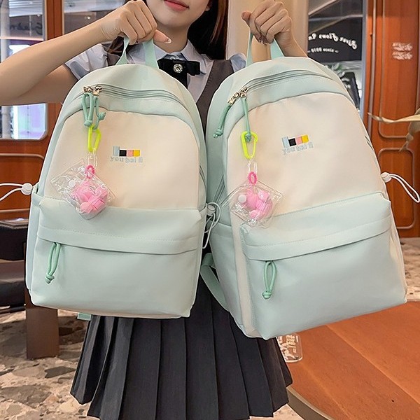 A new Japanese-style Instagram backpack with a high level of appearance, fresh and sweet. It is a large-capacity backpack with color blocking and splicing for junior and senior high school students details Picture