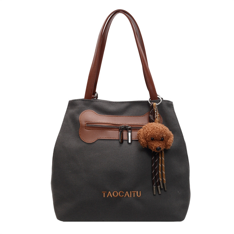 2025 New stylish and versatile canvas tote bag, large-capacity school commuting backpack, casual and simple backpack Item Picture