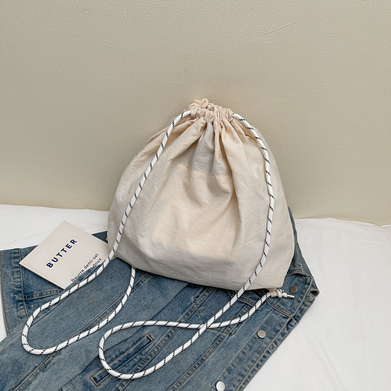 A new Japanese-style trendy fashion backpack, cute cartoon, eco-friendly, drawstring, large-capacity embroidered casual student bag Specification drawing