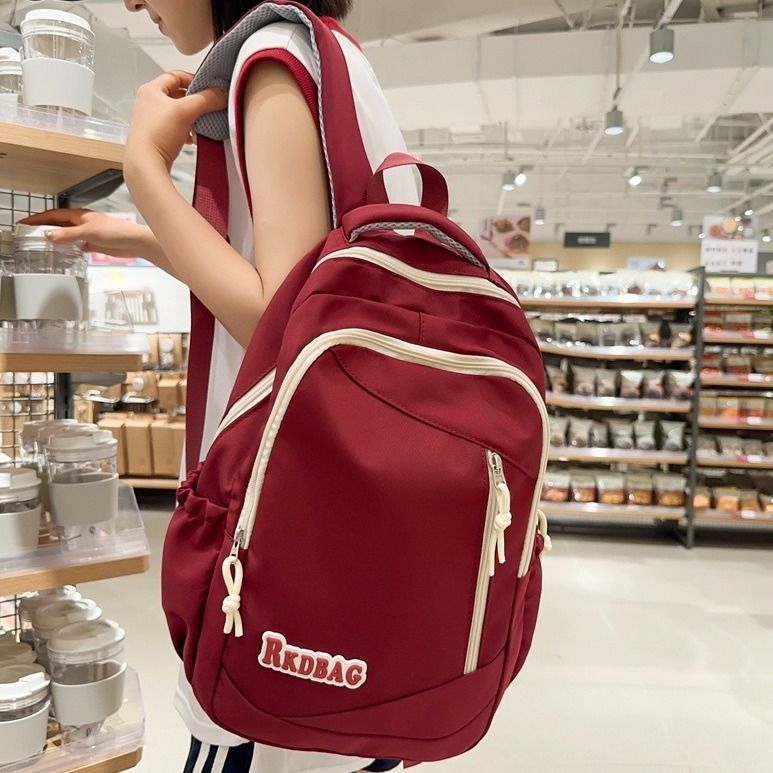 The 2024 new simple and casual middle school backpack for men is trendy, lightweight and versatile. It's a letter travel backpack for women full figure