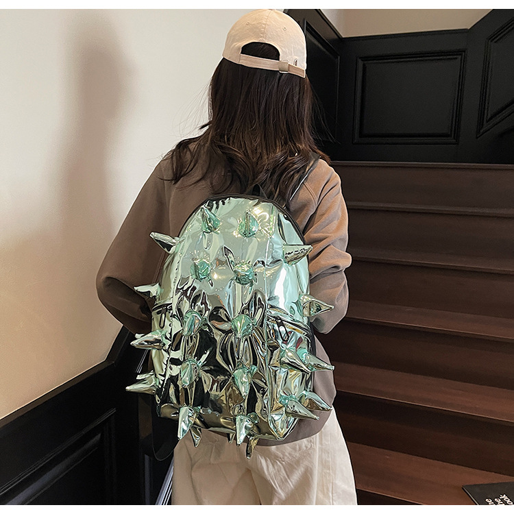 This trendy, spiky design backpack for foreign trade is cool and unique, with a shiny and three-dimensional surface. It's a student backpack that will make you go viral full figure