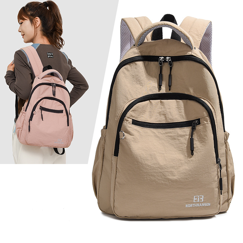 A new lightweight backpack for women in foreign trade, a new simple and sporty climbing bag, an Oxford fabric water-resistant hiking backpack details Picture