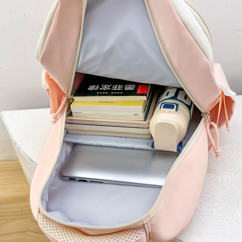 A new Japanese-style Instagram backpack with a high level of appearance, featuring a fresh and sweet school style and color-blocking patchwork. It is a backpack for junior and senior high school students Application Scenario