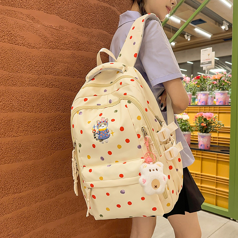 A new high-appeal Japanese-style, fresh and sweet polka dot backpack with contrasting colors for junior and senior high school students. It is a lightweight and large-capacity backpack details Picture