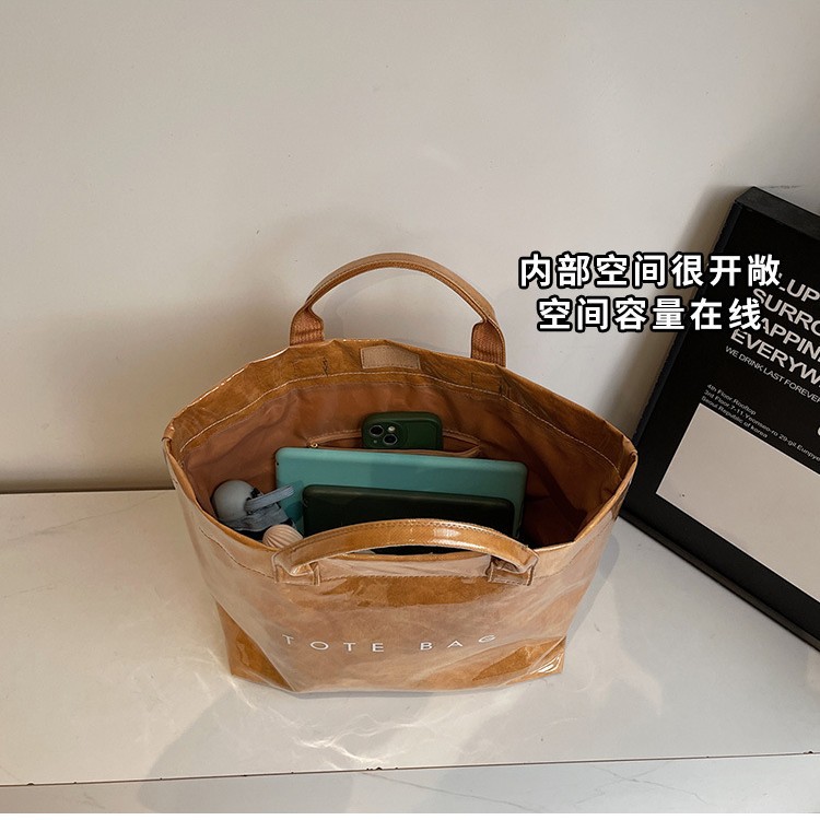 A versatile large-capacity DuPont paper bag 2025 new style fashionable transparent PVC waterproof tote bag for commuting Application Scenario