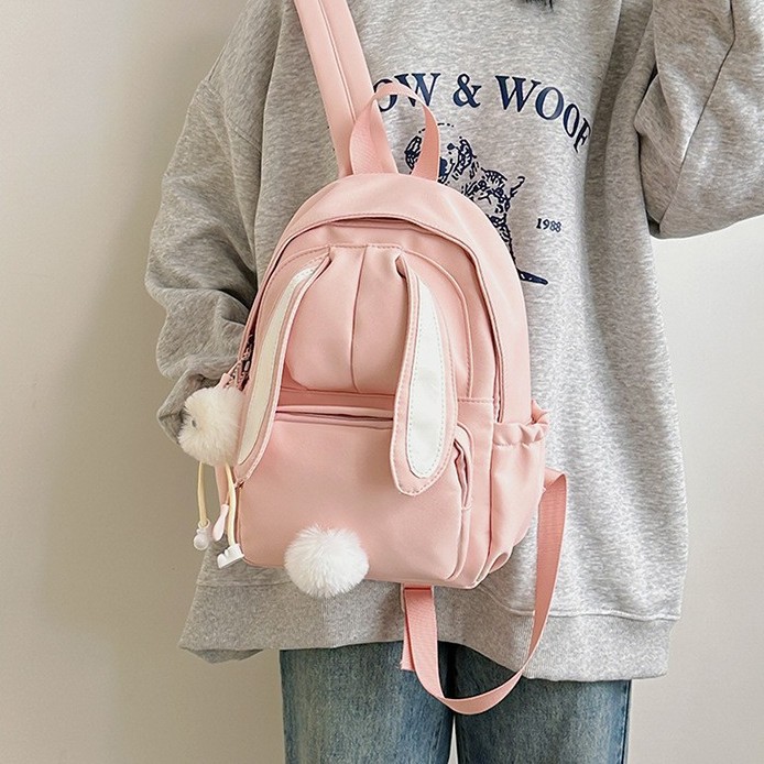 A Japanese girl with a high level of appearance, a mini backpack for traveling and shopping on Instagram, and a cute little backpack for children's spring outings and study Tours full figure