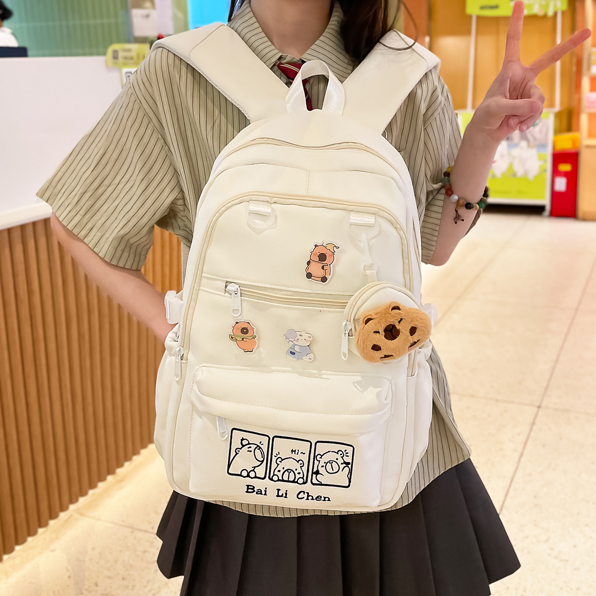 A new high-appearance-level, fresh, sweet and cute Capibara backpack from Forestry-style ins, a lightweight backpack for junior and senior high school students details Picture