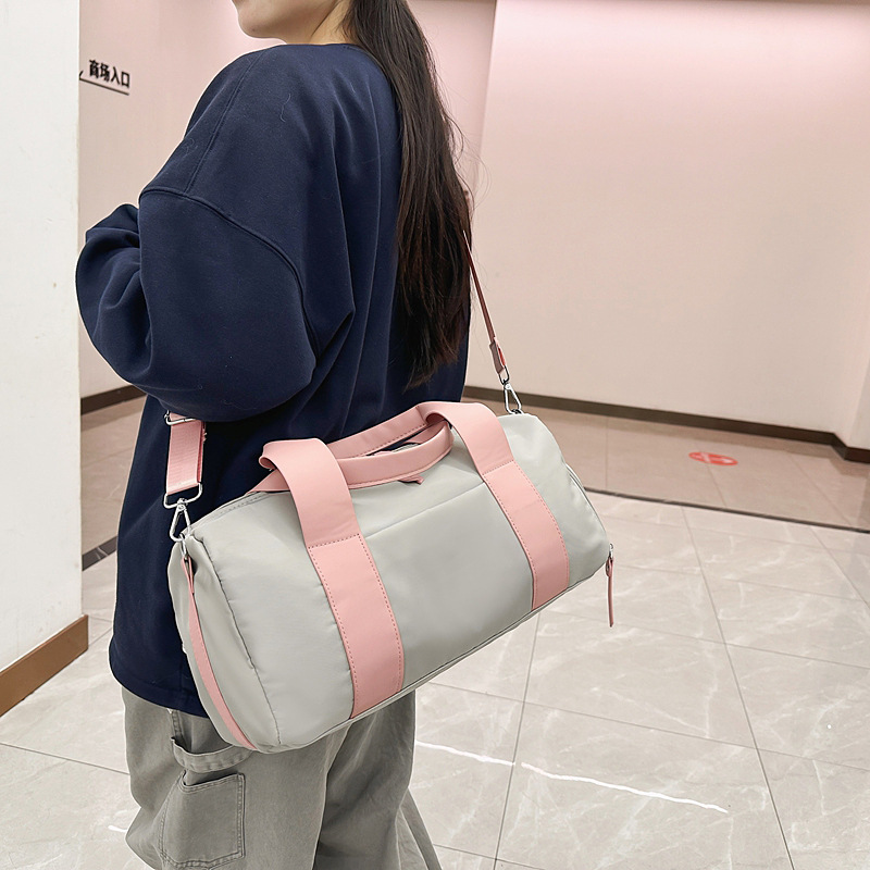 A new solid-color casual, simple and lightweight travel and fitness sports bag for women with a high appearance level and large capacity full figure
