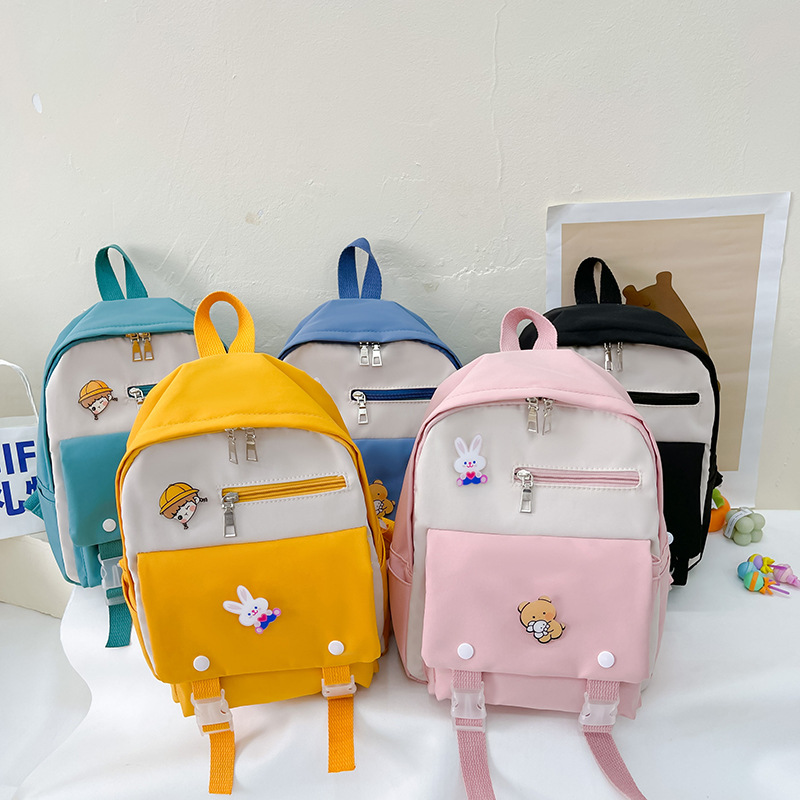 New cartoon color-blocking backpack, cute student schoolbag, casual and fashionable children's backpack for boys and girls full figure
