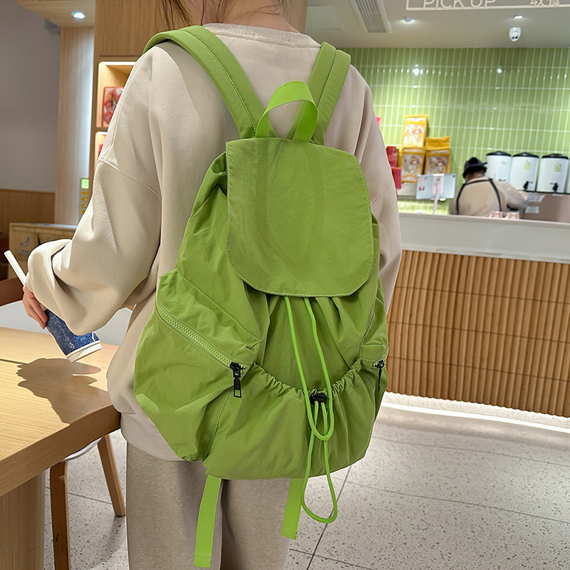 Ultra-light water-washable nylon commuting single backpack with drawstring, simple and versatile for daily use, portable and casual student schoolbag full figure