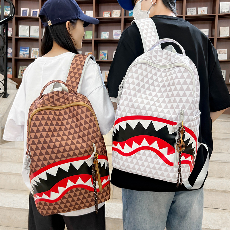 A new high-appearure-level trendy shark graffiti print backpack for junior and senior high school students, a versatile and fashionable backpack for commuting details Picture