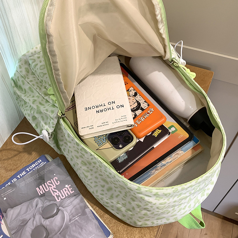 A new high-appearance-level Japanese ins fresh and sweet leopard print mini backpack with large capacity for junior and senior high school students Application Scenario