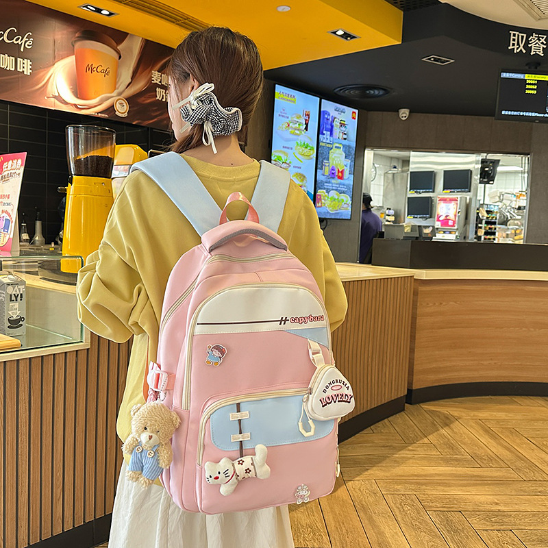 A new high-appearance-level Japanese ins fresh and sweet candy-colored color-blocking backpack with large capacity for junior and senior high school students full figure