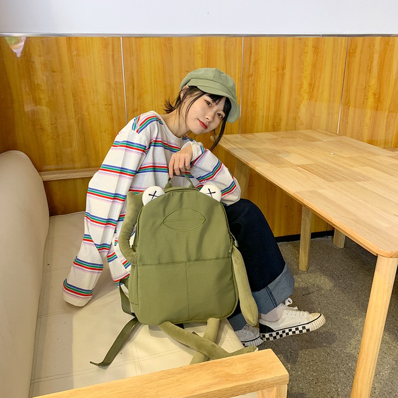 A new Korean style personalized backpack for girls, cute and ugly frog, creative and creative, versatile on Instagram, and a student casual backpack details Picture