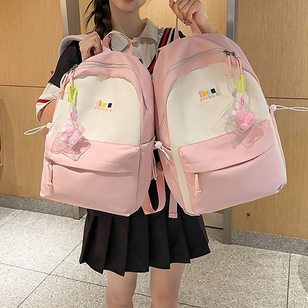 A new Japanese-style Instagram backpack with a high level of appearance, fresh and sweet. It is a large-capacity backpack with color blocking and splicing for junior and senior high school students full figure