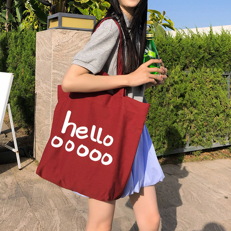 The new Korean version single-shoulder bag features a large capacity, versatile letter tote bag, a simple, casual and trendy bag, and a student shopping bag full figure