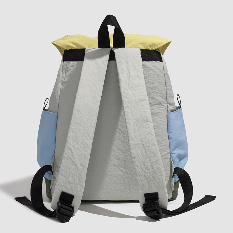 The 2025 new color-blocking backpack is a lightweight, casual and versatile backpack for junior and senior high school students as a couple. It is also suitable for traveling Specification drawing