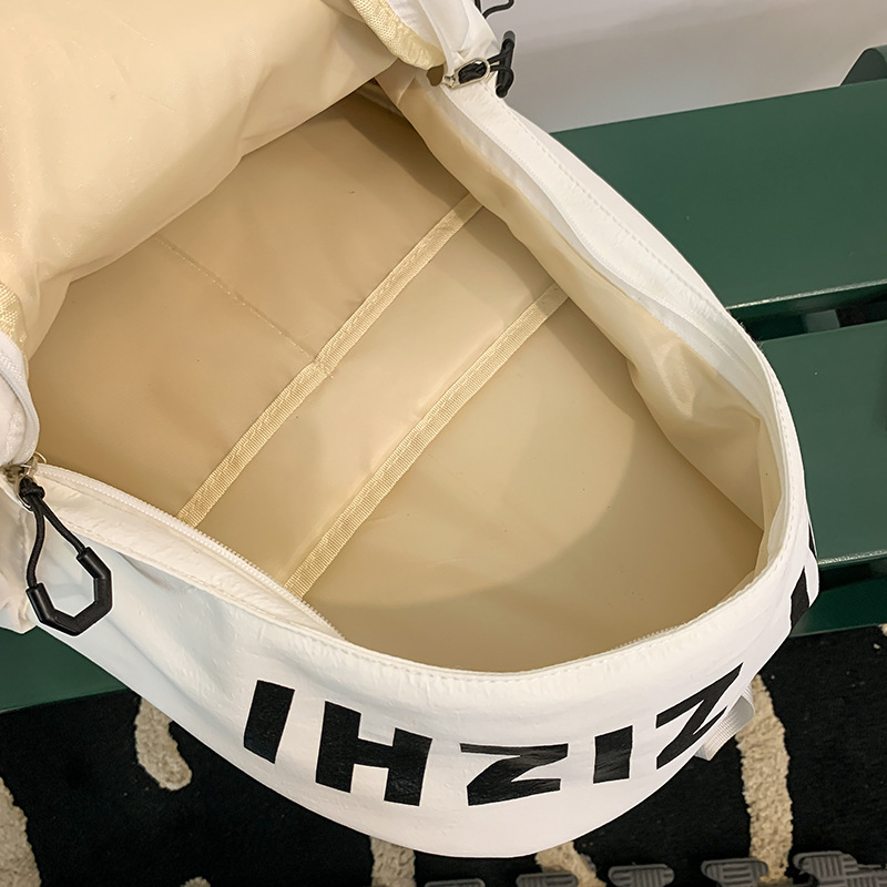 2025 New style simple letter backpack for middle school students, Japanese trendy brand college student couple travel backpack Application Scenario
