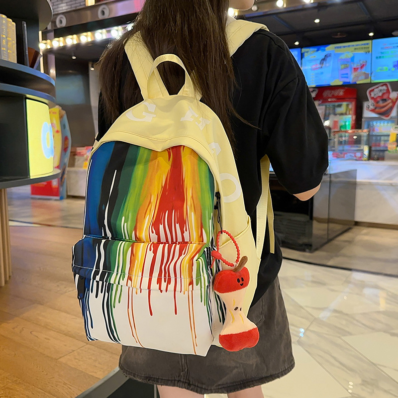 A new high-appearure-level Japanese ins rainbow graffiti backpack for junior and senior high school students, a casual, lightweight and large-capacity backpack details Picture