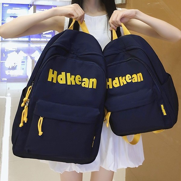 A new Korean-style ins high-appearment-level solid color simple letter backpack for couples, a casual, lightweight and large-capacity backpack details Picture