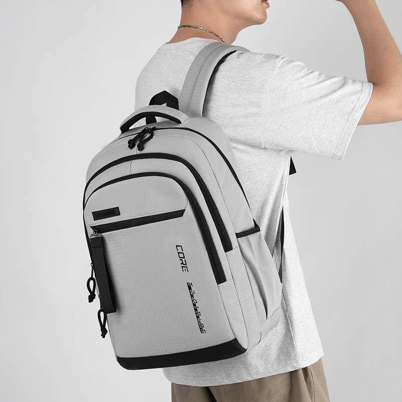 The new boys' multi-layered schoolbag for junior and senior high school students is a versatile and stress-reducing backpack for the campus and a casual backpack for the back-to-school season full figure