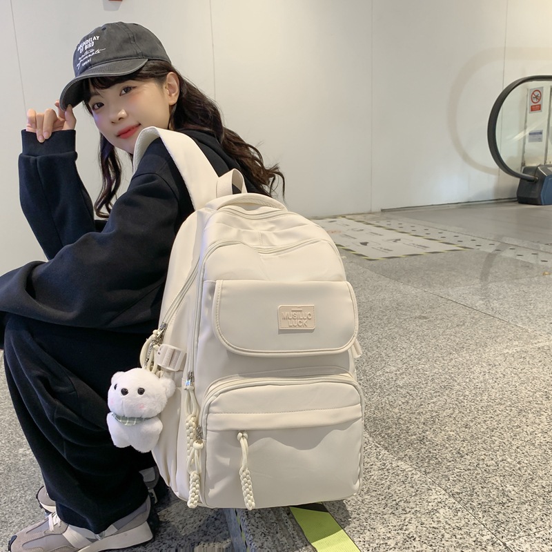 Japanese-style ins backpack with a large capacity and multiple compartments, lightweight middle school backpack and college student travel backpack full figure