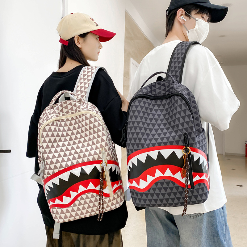 A new high-appearure-level trendy shark graffiti print backpack for junior and senior high school students, a versatile and fashionable backpack for commuting full figure