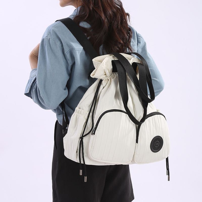 2025 New large-capacity casual backpack with drawstring, a lightweight backpack for commuting and traveling, and a single-shoulder bag for college students attending classes full figure