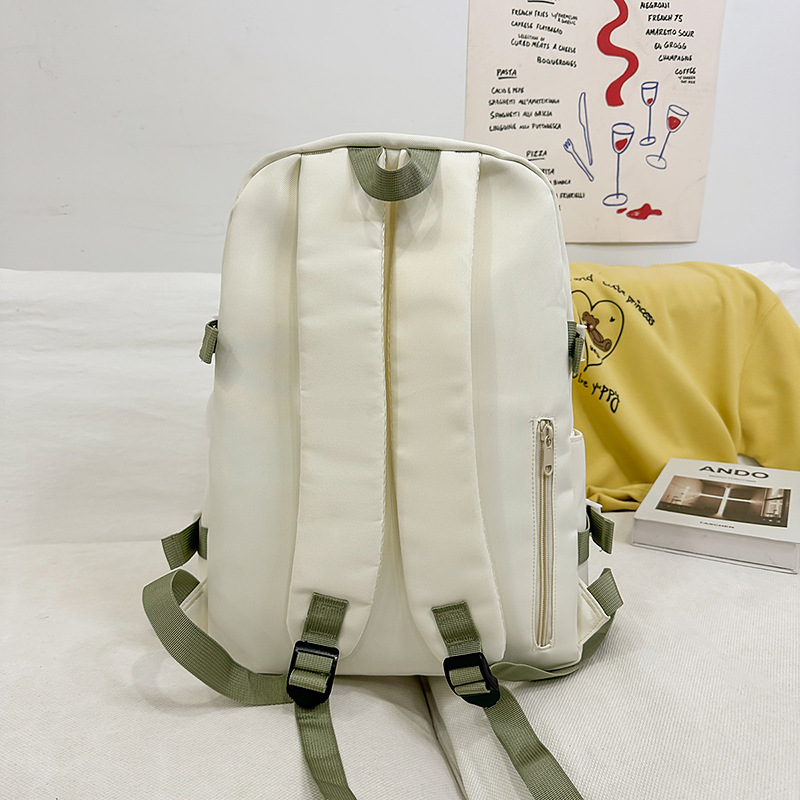 A new solid-color cute bow backpack with a high aesthetic level. It is a versatile backpack for junior and senior high school students, suitable for commuting and travel Specification drawing