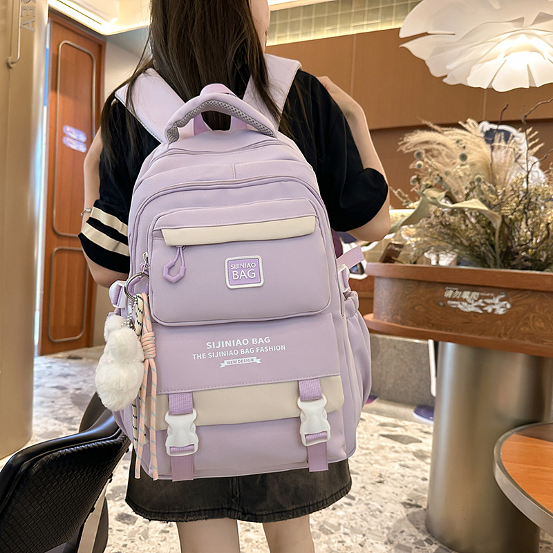 The new schoolbag for girls' high school students features a striking color contrast. It is a high-quality multi-layered backpack for primary and secondary school students full figure
