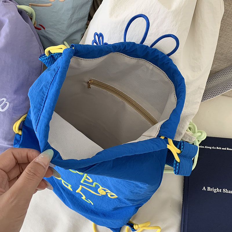 A new high-look, cool and cute cartoon-embroidered drawstring backpack from Korean Instagram, a simple and lightweight children's backpack Application Scenario