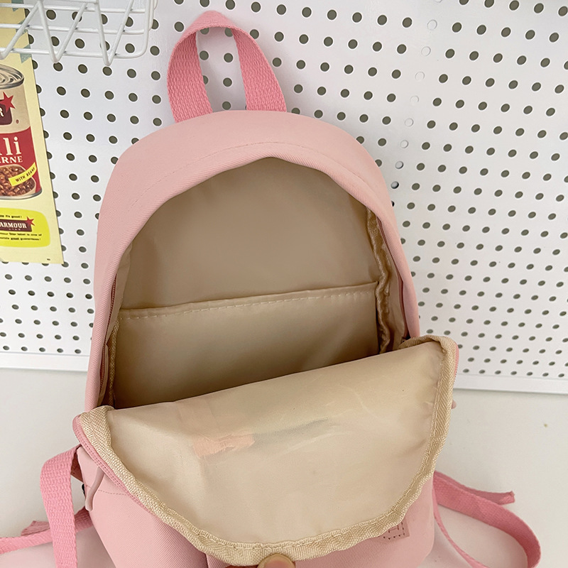 A simple and cute female college student's small backpack for shopping and attending classes. A cute mini backpack for children's spring outing Application Scenario