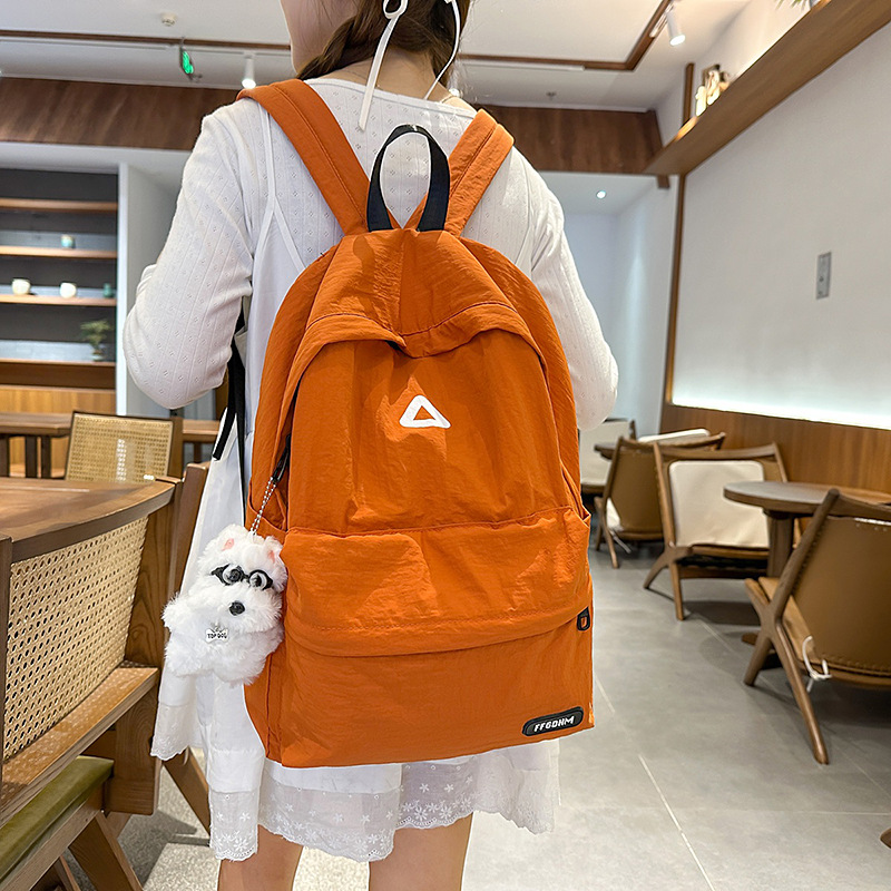 A new high-appearance-level forest-themed ins fresh candy-colored backpack, a lightweight and large-capacity backpack for junior and senior high school students full figure