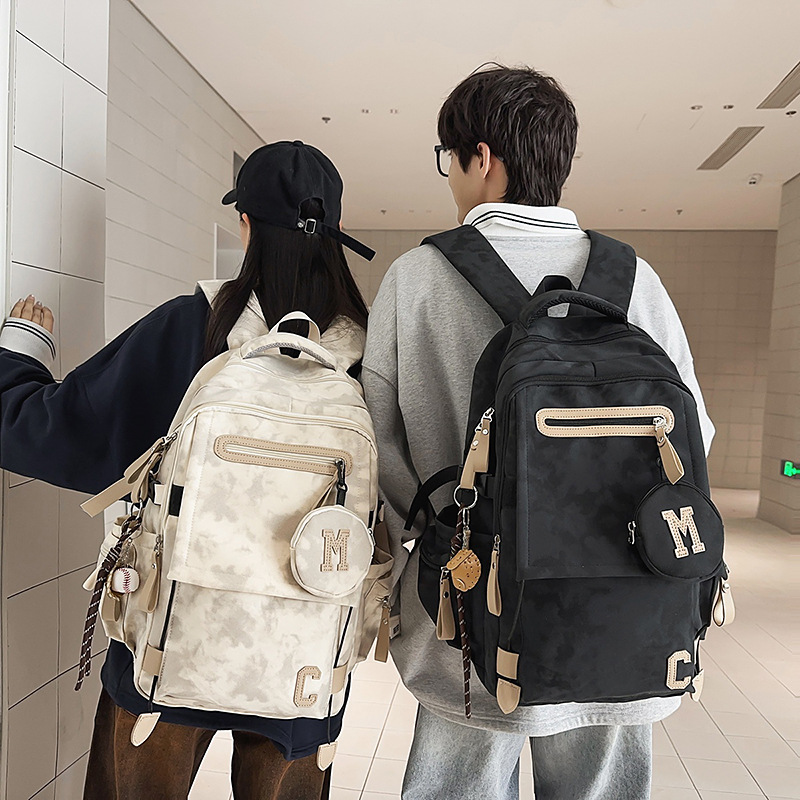 A new high-appearance-level Korean ins fresh and individual tie-dyed backpack, a lightweight and large-capacity backpack for junior and senior high school students full figure