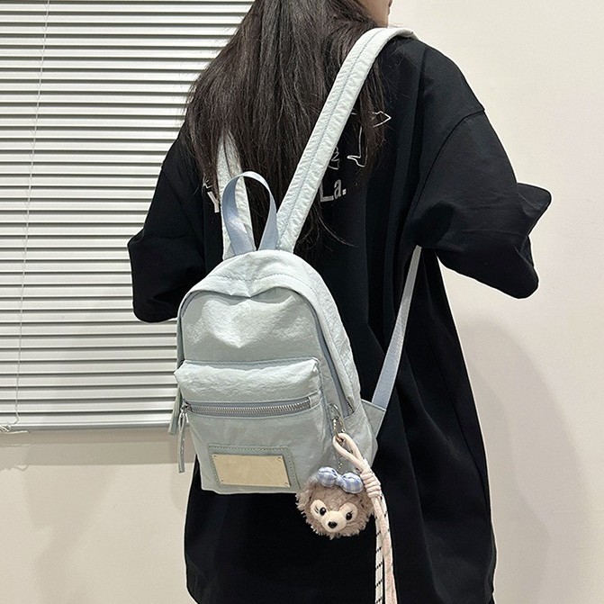 This is a new cute mini backpack for summer, featuring a laid-back style and a simple, casual Korean-style Instagram blue travel bag details Picture