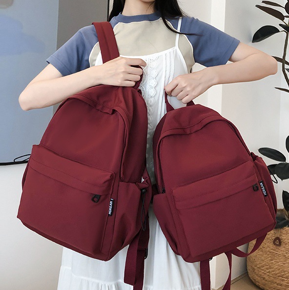 Solid-color schoolbag for female college students, simple and ins-style Korean backpack, high appearance level backpack for female junior and senior high school students full figure