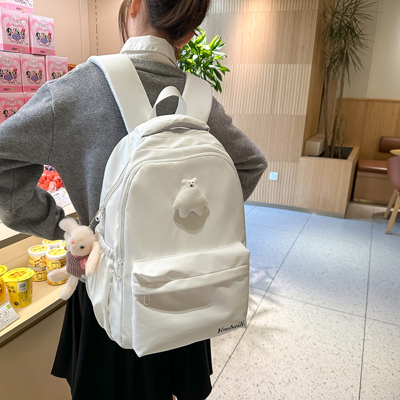 Solid-colored girls' backpacks, simple and lightweight schoolbags for junior high school students, cute little bears for girls, versatile backpacks for college students details Picture