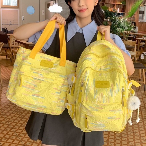 A large-capacity backpack for junior high school students with high appearance standards, a Korean-style ins cream yellow two-piece backpack set for primary and secondary school students full figure