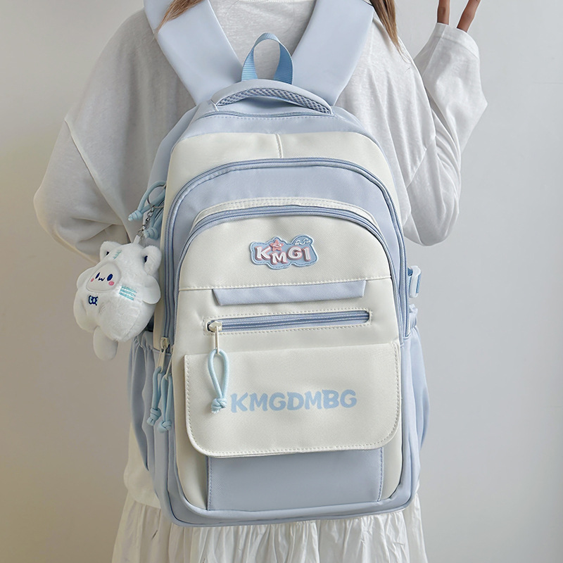 A new Japanese-style backpack with a high level of appearance, fresh and sweet, color-blocking and patchwork style, and a large capacity backpack for junior and senior high school students full figure