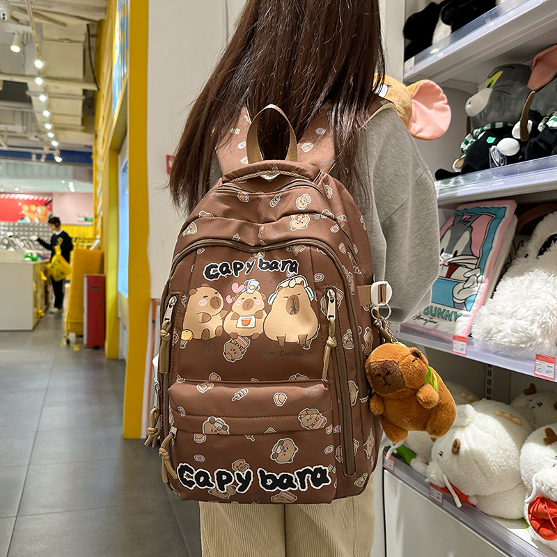 New cute, ugly and adorable cartoon printed backpack for primary and secondary school students in grades 3 to 6, high appearance level, fresh and clean backpack for girls full figure