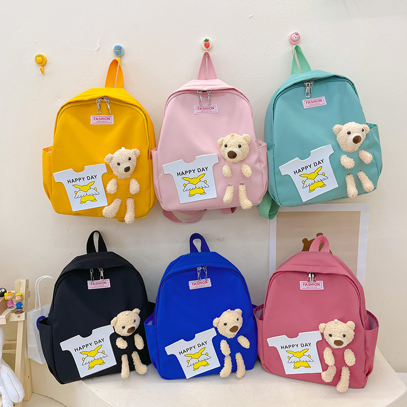 The 2022 new color-blocking large-capacity backpacks for boys and girls, Harajuku style schoolbags, and children's cartoon backpacks are in a trend full figure