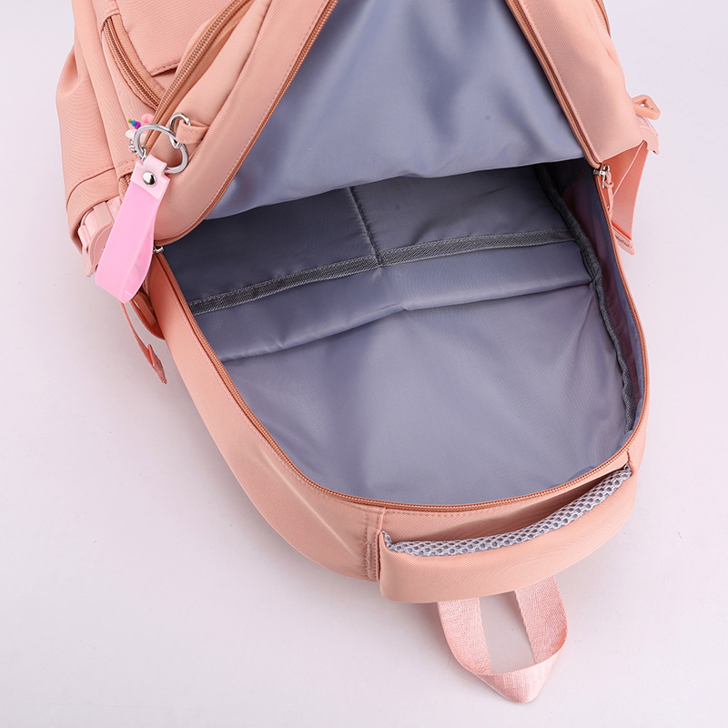 A new large-capacity backpack for junior and senior high school students with multiple compartments and a suitcase for travel Application Scenario