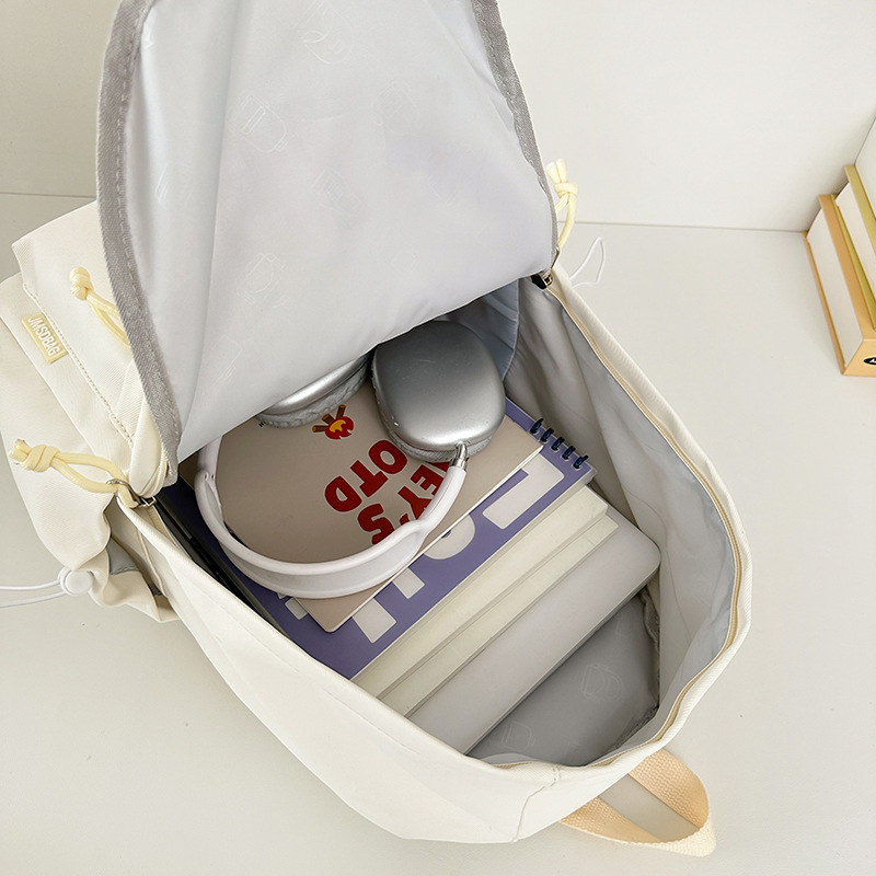 A new high-appearance-level letter-style backpack for couples in a solid color, casual, simple, lightweight and large-capacity backpack from the Korean version of Instagram Application Scenario