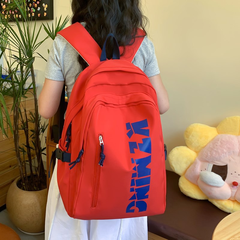 A Japanese-style Instagram backpack with a high level of appearance and solid color letters for junior and senior high school students. It is a casual, simple and large-capacity backpack full figure